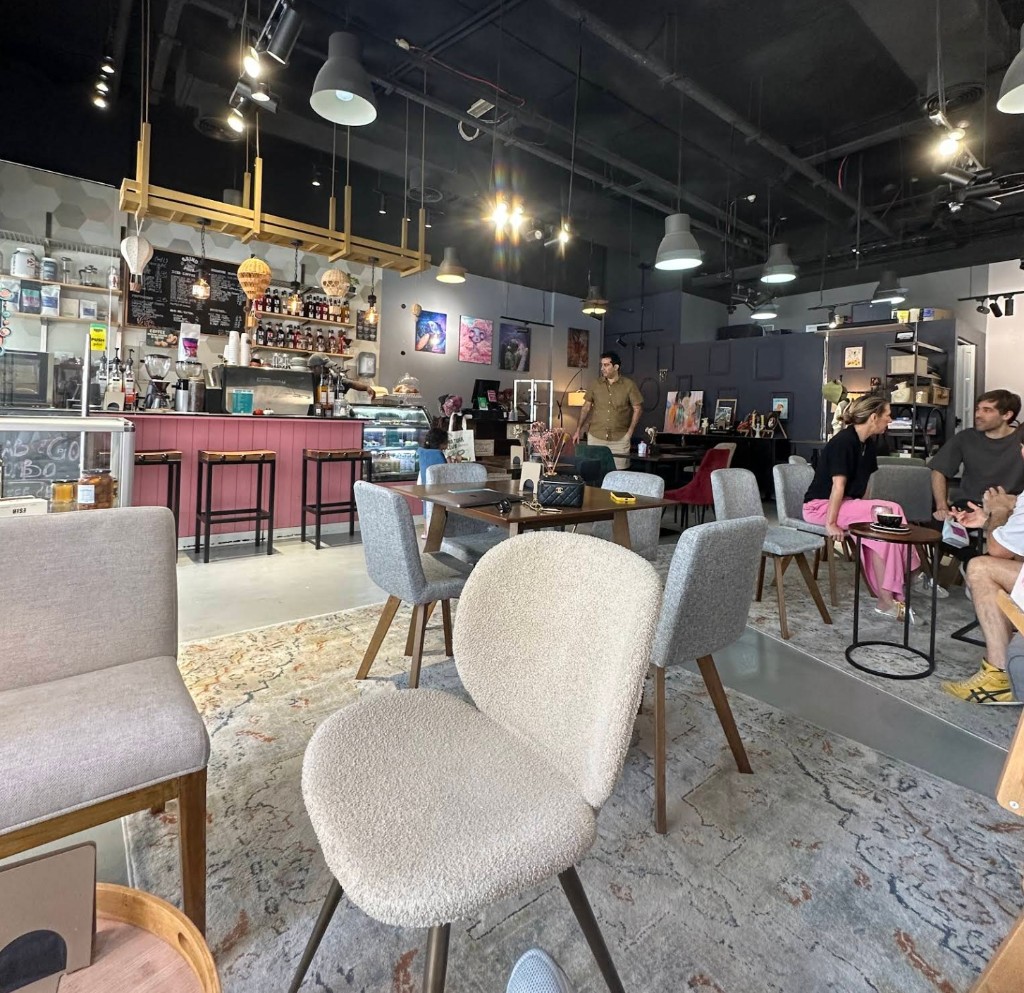 Warm and inviting cafe interior with bouclé lounge chairs